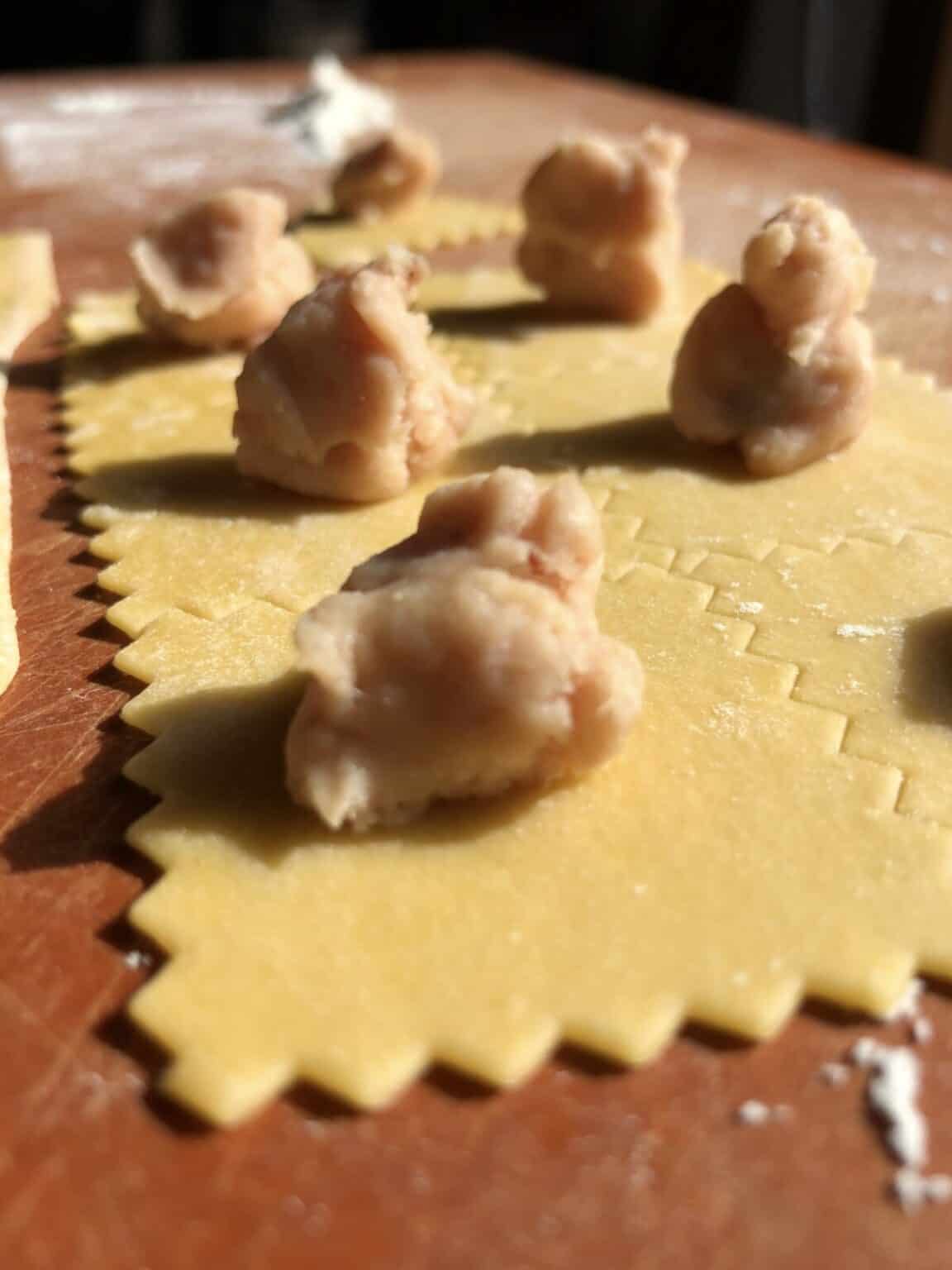 Authentic Homemade Italian Tortellini (Tortellini in Brodo) Biting at