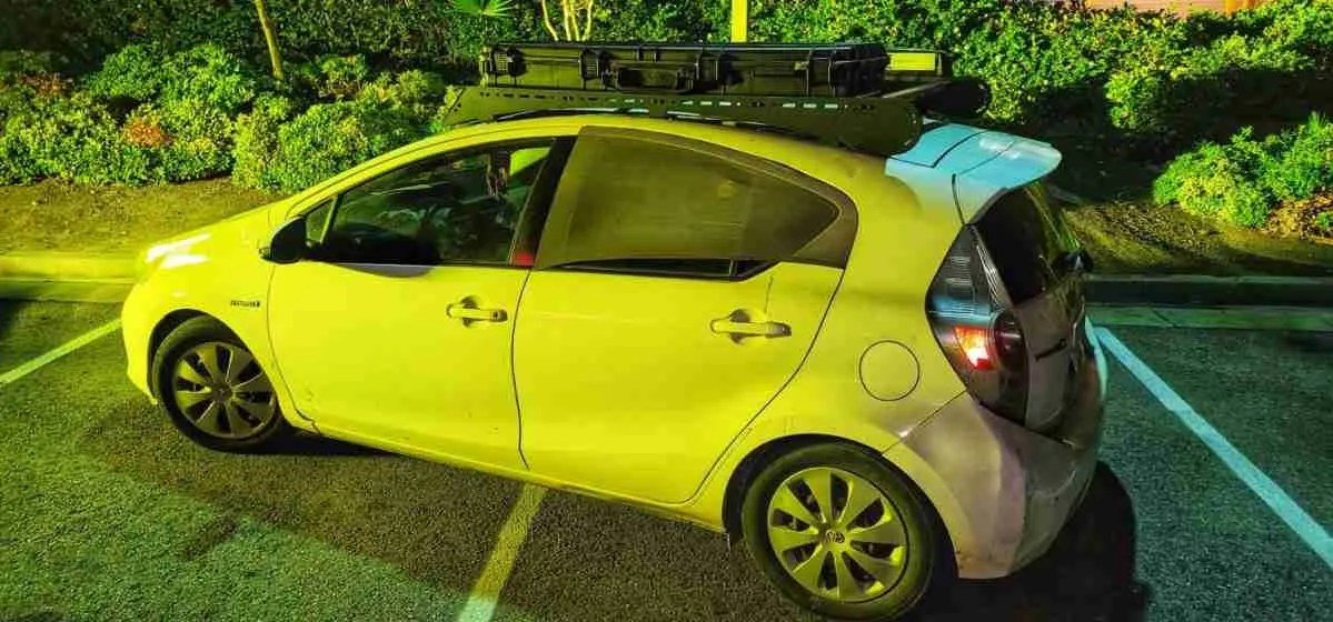 Prius C with a Low Profile Roof Rack, Rooftop Awnings, and Harbor Freight Weatherproof