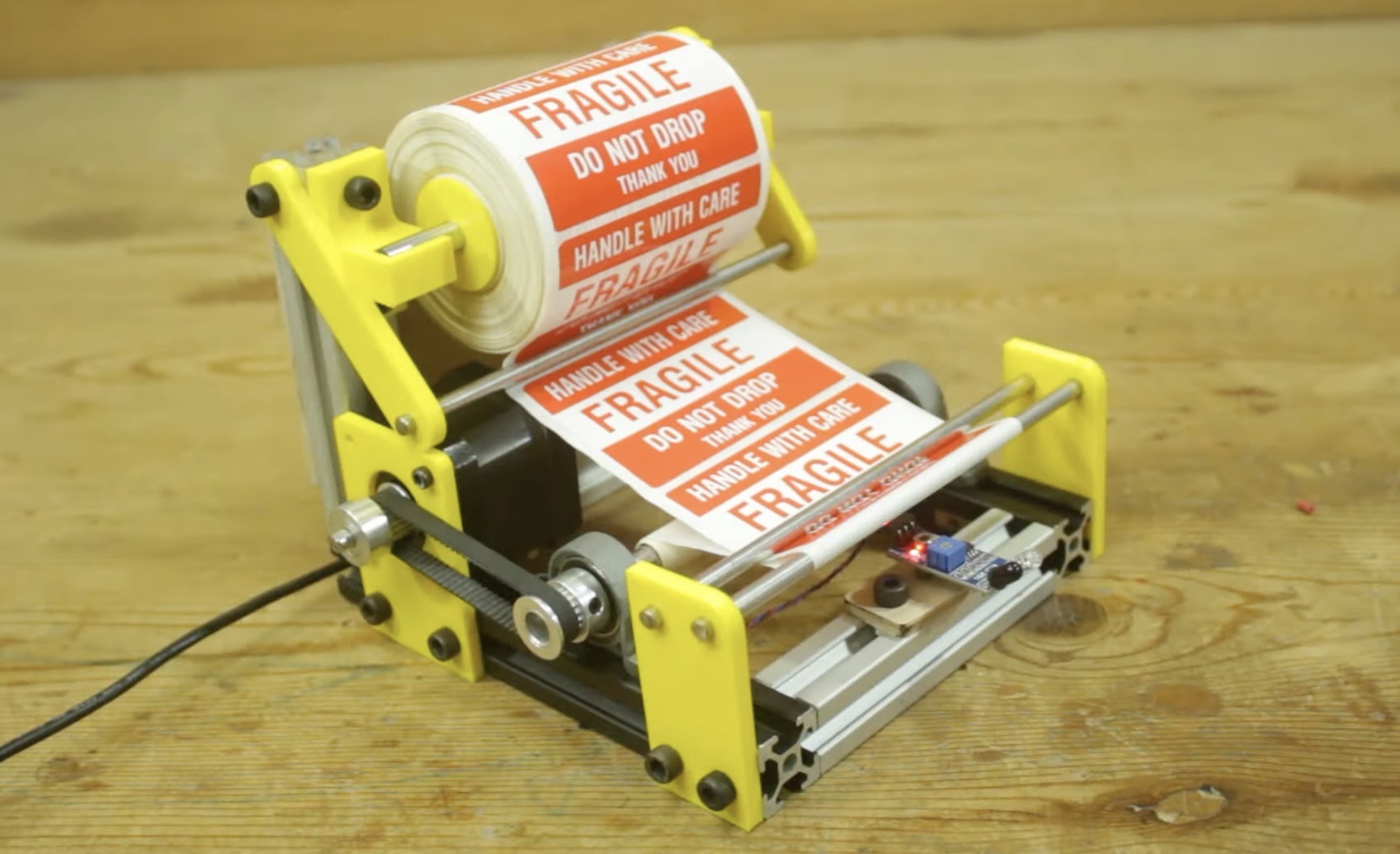 This simple machine quickly dispenses labels Arduino Blog