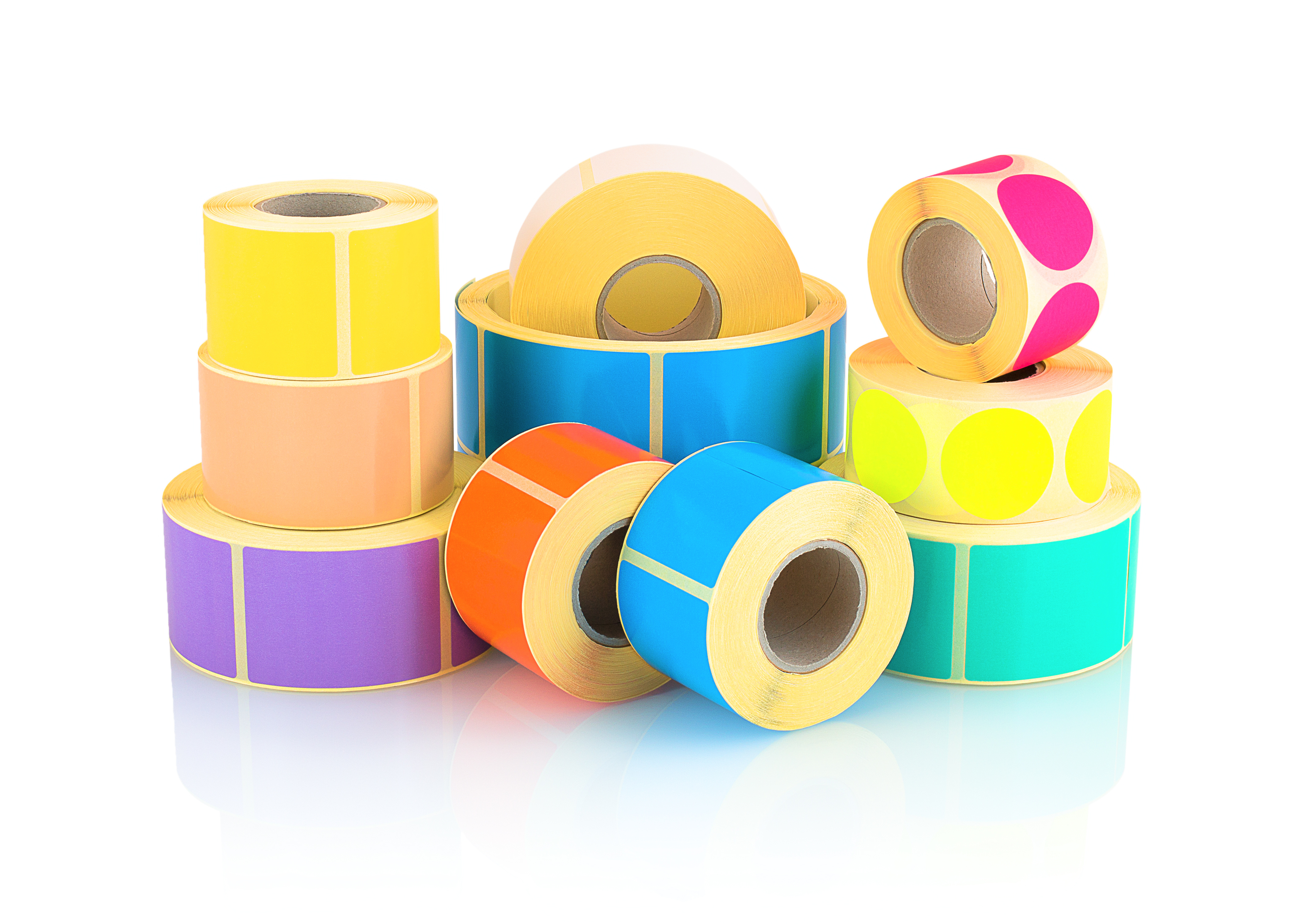 Colored label rolls isolated on white background with shadow reflection
