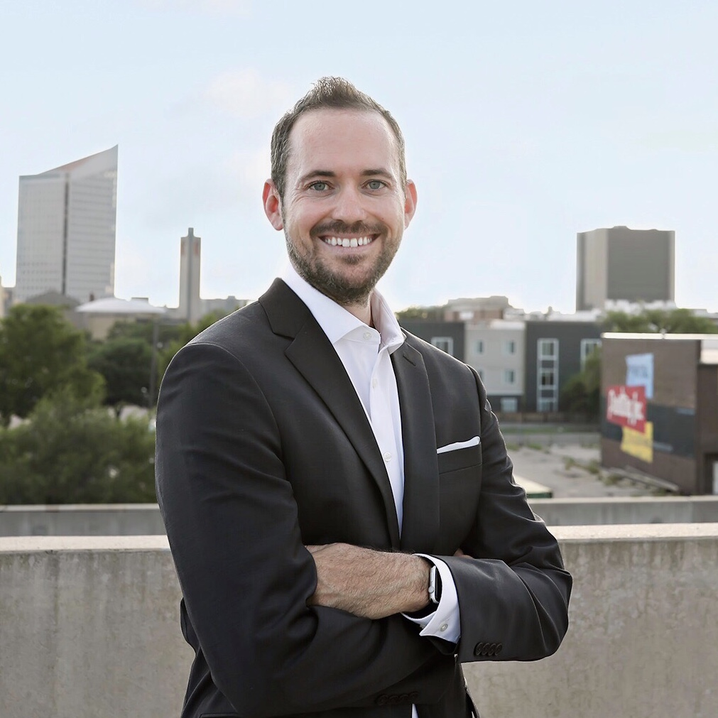 dr ryan dopps with wichita kansas skyline