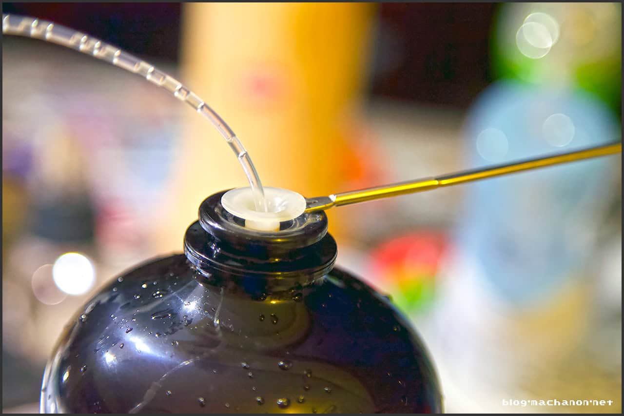 Carefully push the seafood fork up, then rotate so it is parallel with the TORP neck and continue to push up until the tube topper is exposed.