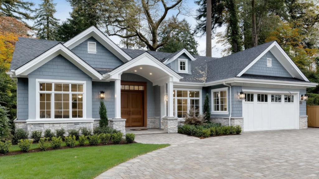Harbor Ridge home exterior, blue/gray home with landscaped lawn