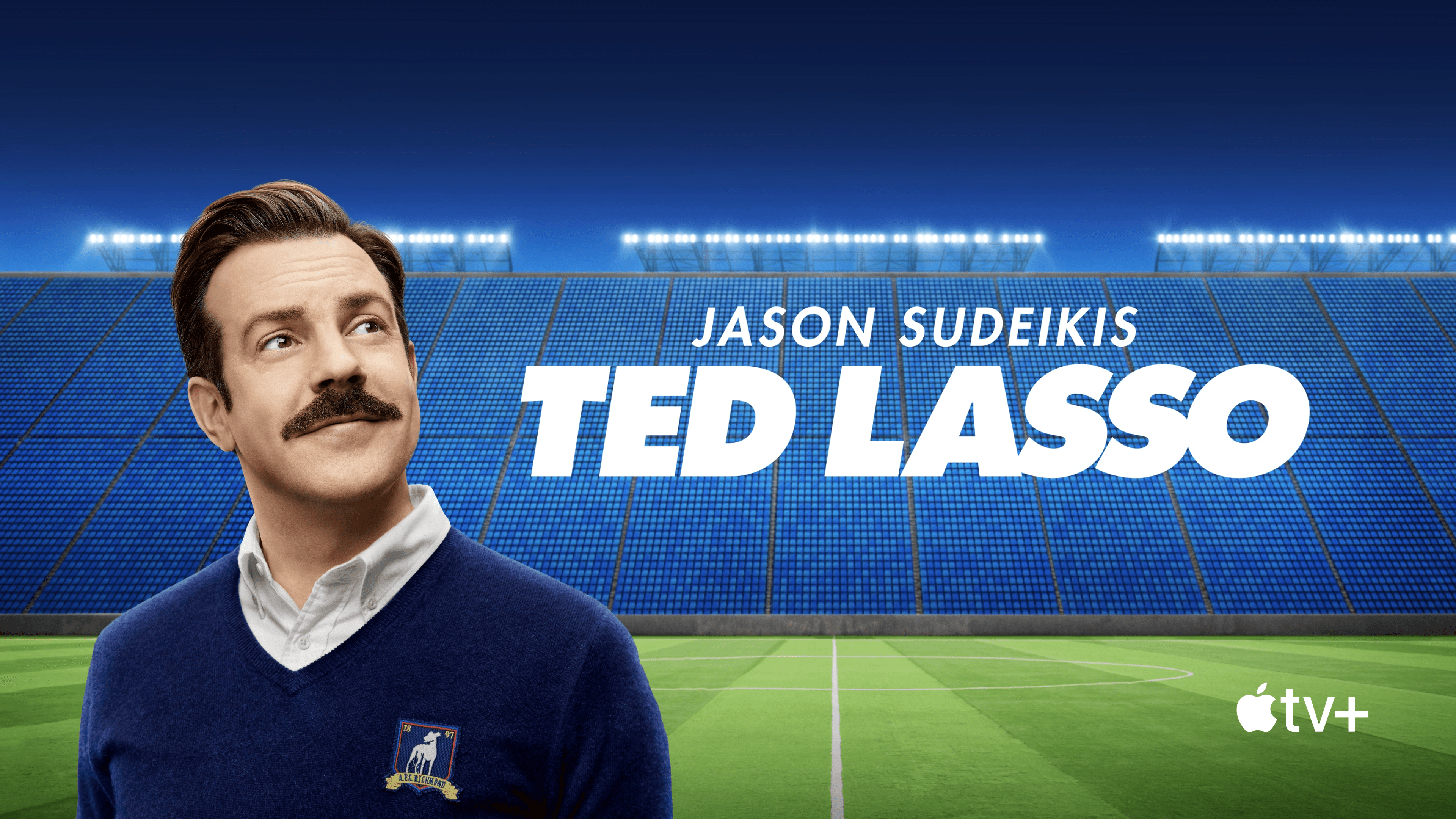 Jason Sudeikis as Ted Lasso in a stadium 