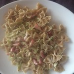 Homemade pesto pasta with bacon on a plate
