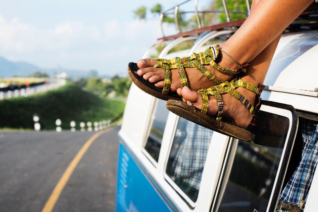 feet dangling off a camper van