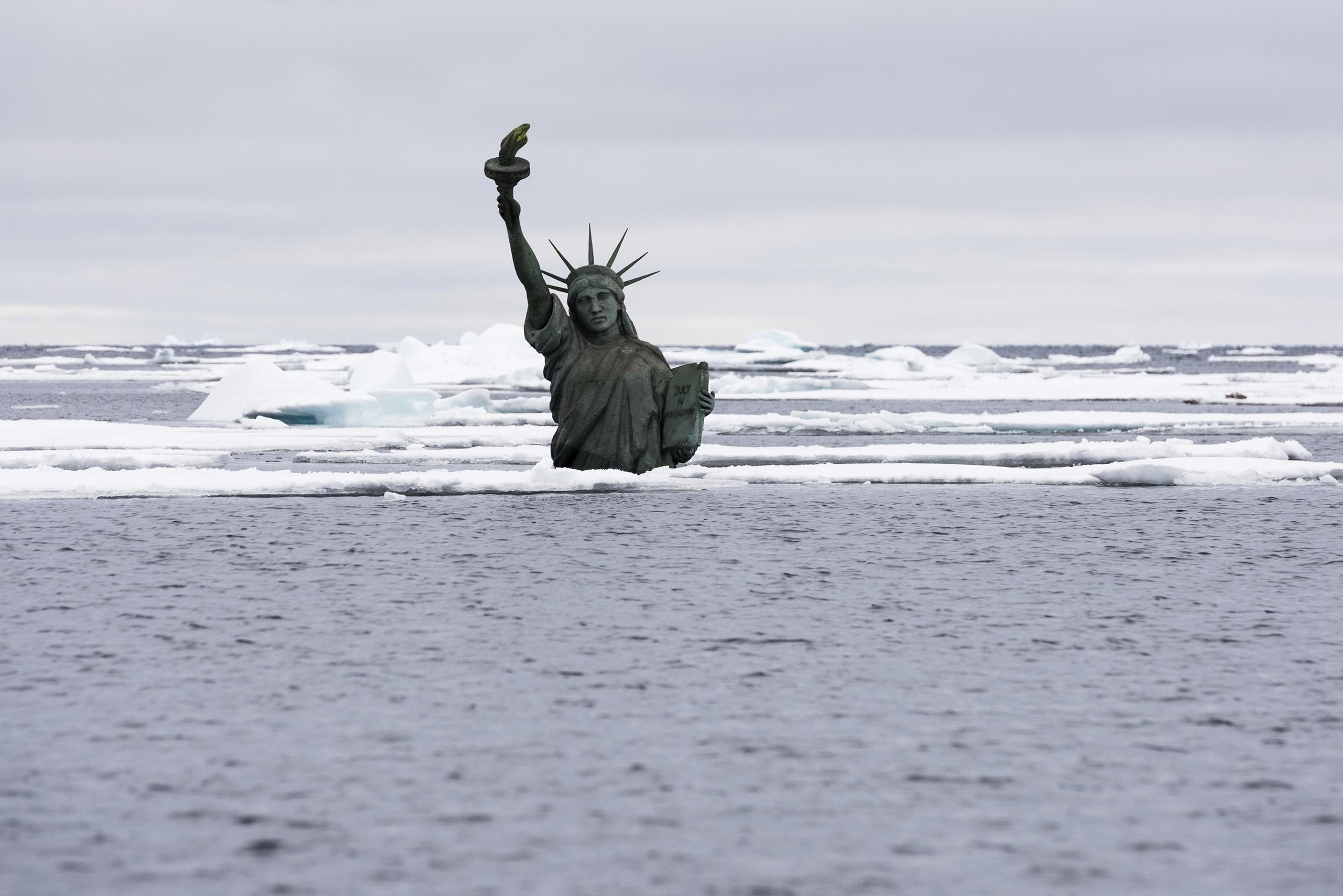 A semisubmerged Statue of Liberty in the Arctic Ocean for Lady Liberty