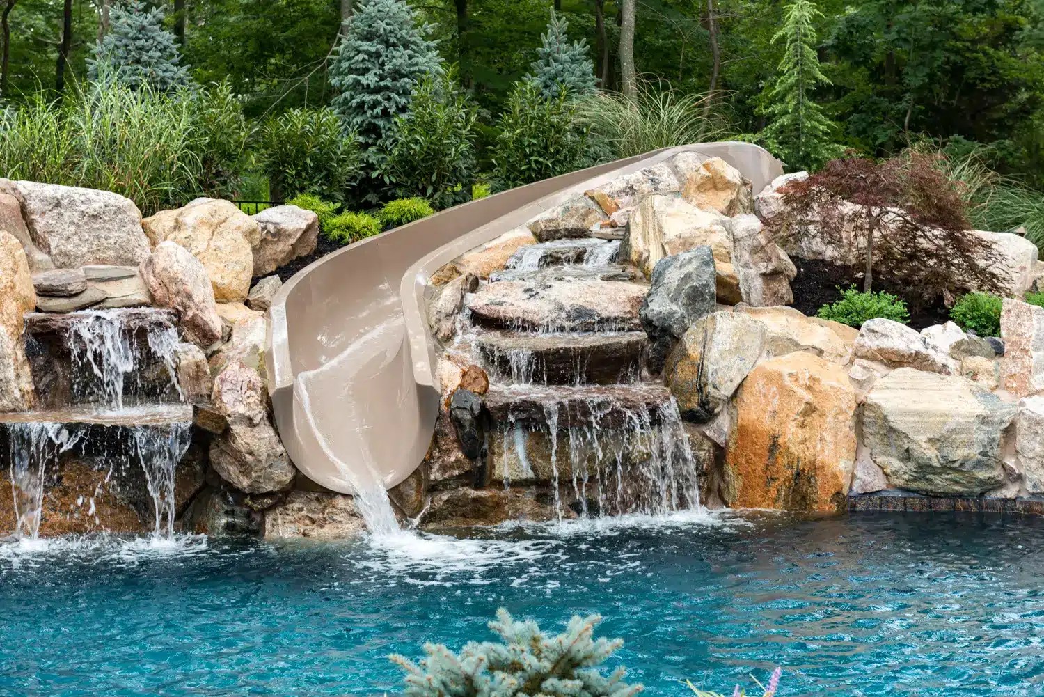 Guide to Pool Slides with Rocks for Your Backyard Oasis