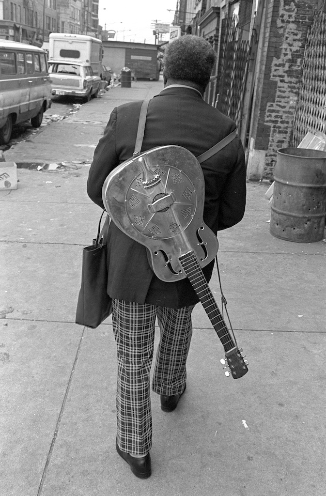 Street Musician with Guitar on Back Bob Rehak Photography
