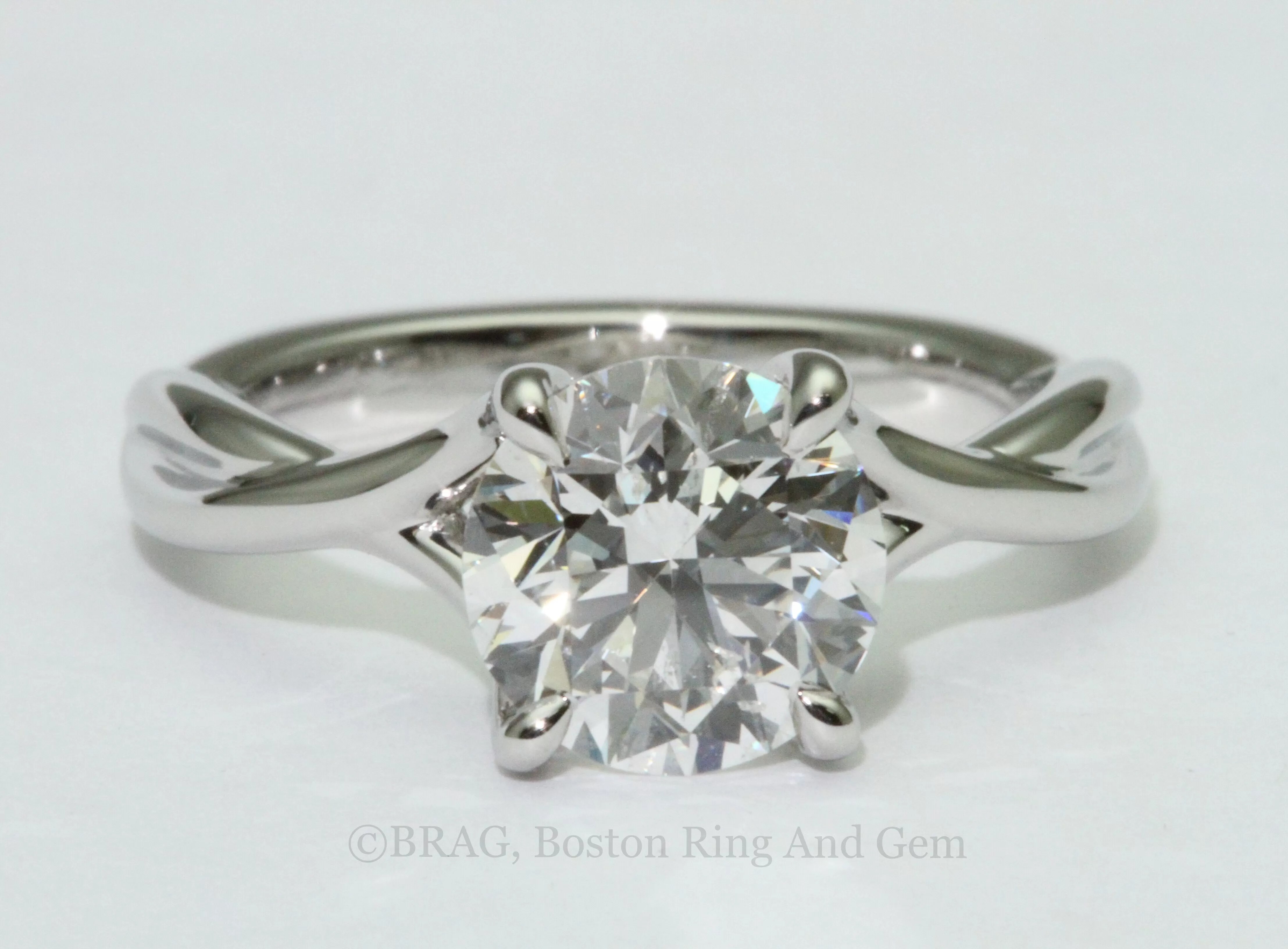 platinum engagement ring diamond solitaire unique twist Boston Ring