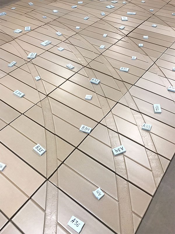 Pacific Gate Condominiums, KPF, Terra Cotta Entry Wall, Rising Sun