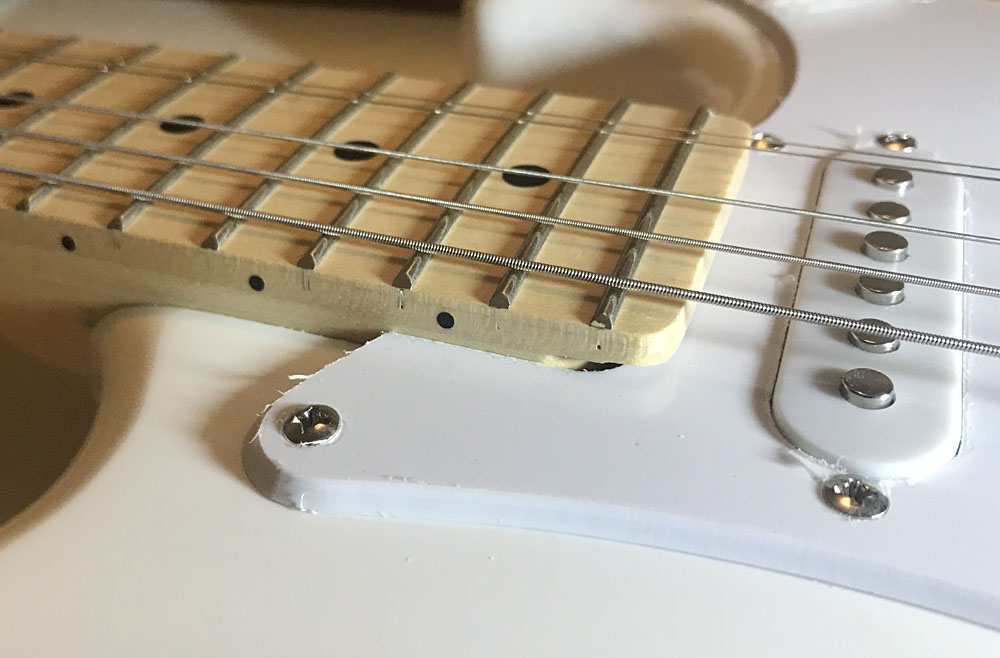 I cannot relocate the bridge. Can you help me SLIP THE NECK? Fender