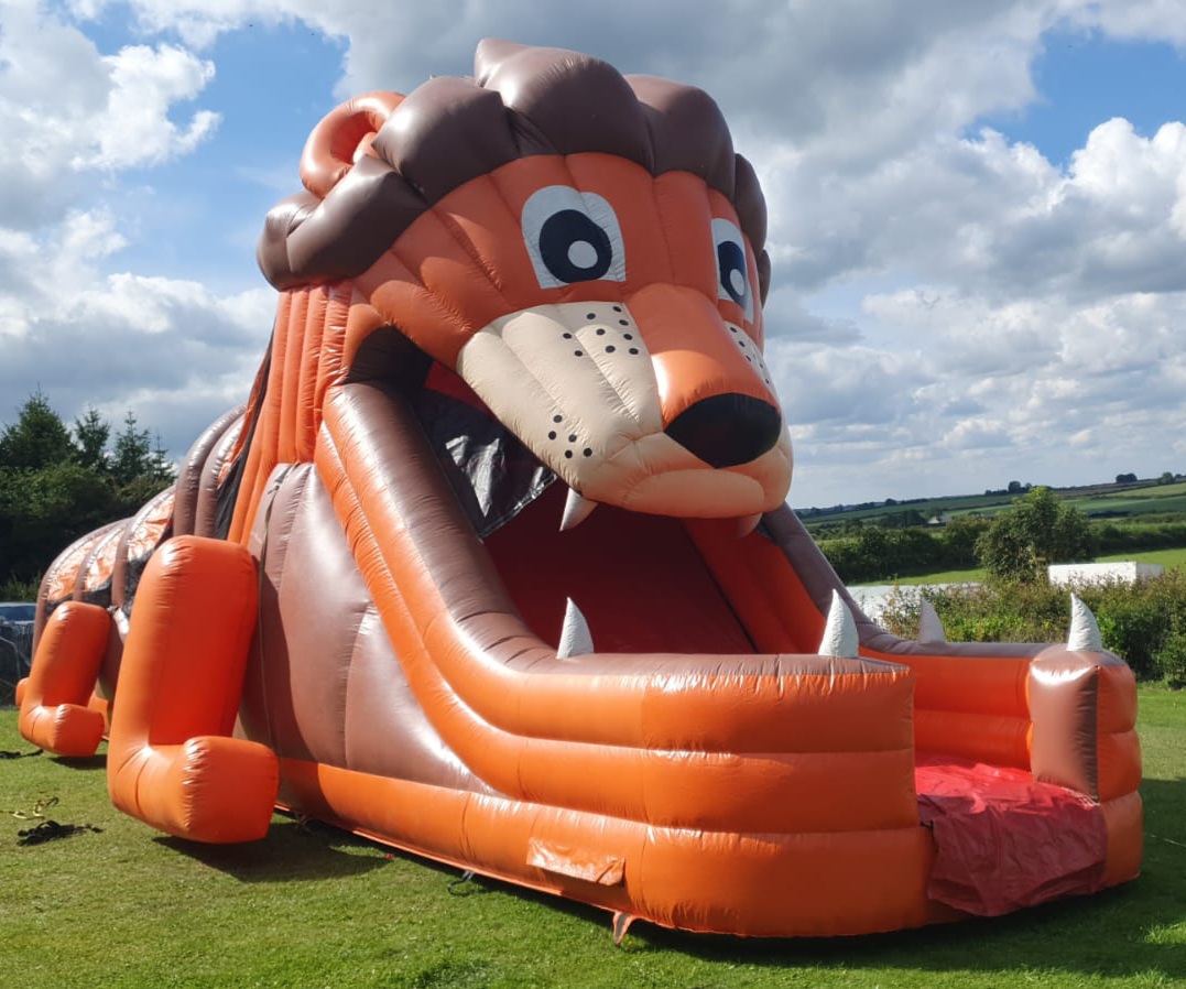50 ft Lion OB With Large Slide..... HIRE 1 DAY AND GET SECOND DAY FREE