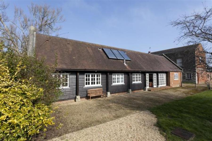 Barton tennis in walled garden with flowers Images The Barton