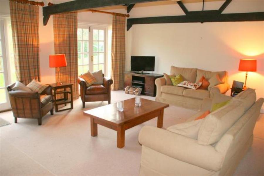 Barton tennis in walled garden with flowers Images The Barton