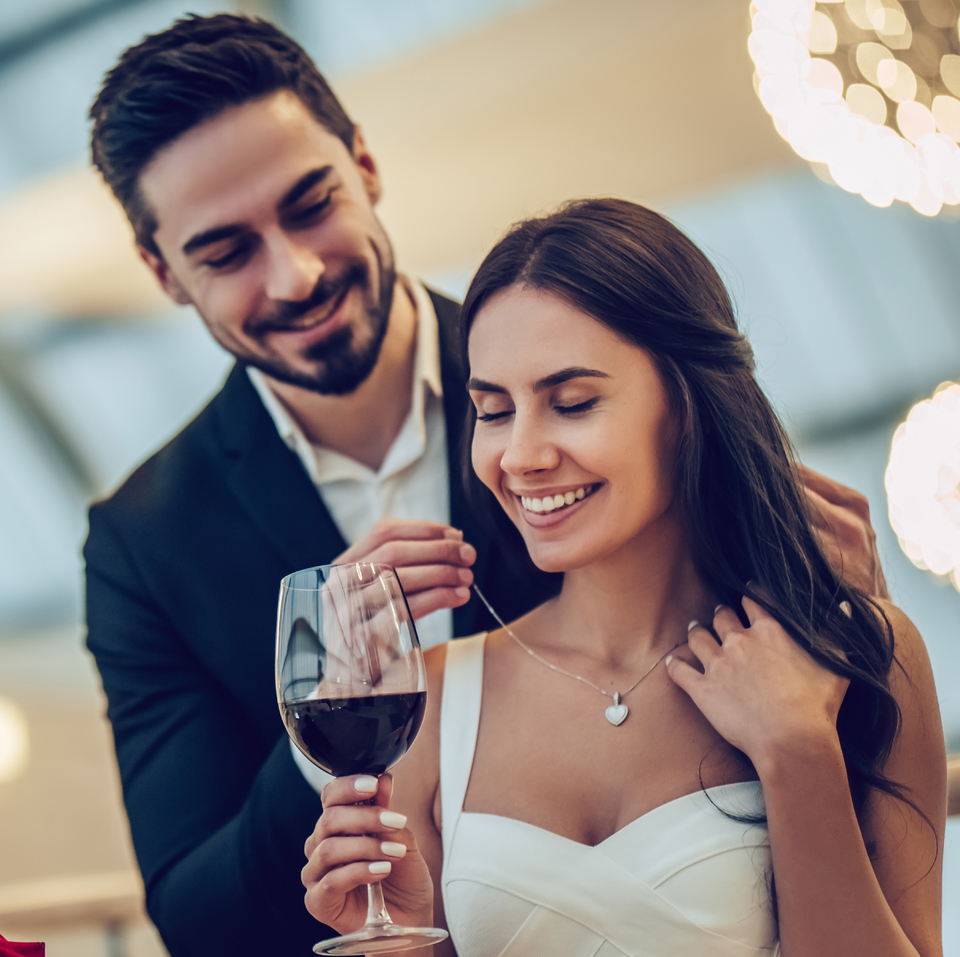 putting on necklace Breslauer Warren Jewellers