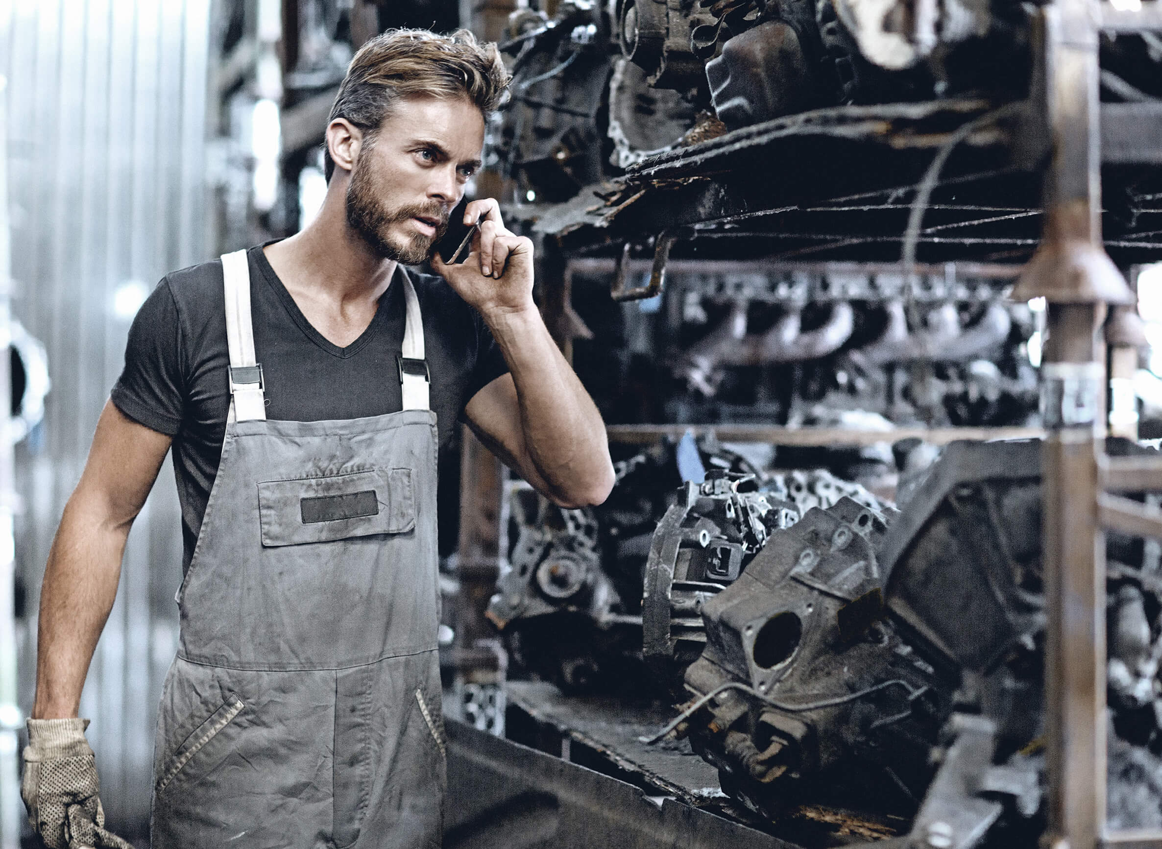 male mechanic working at junkyard storage Blue Streak