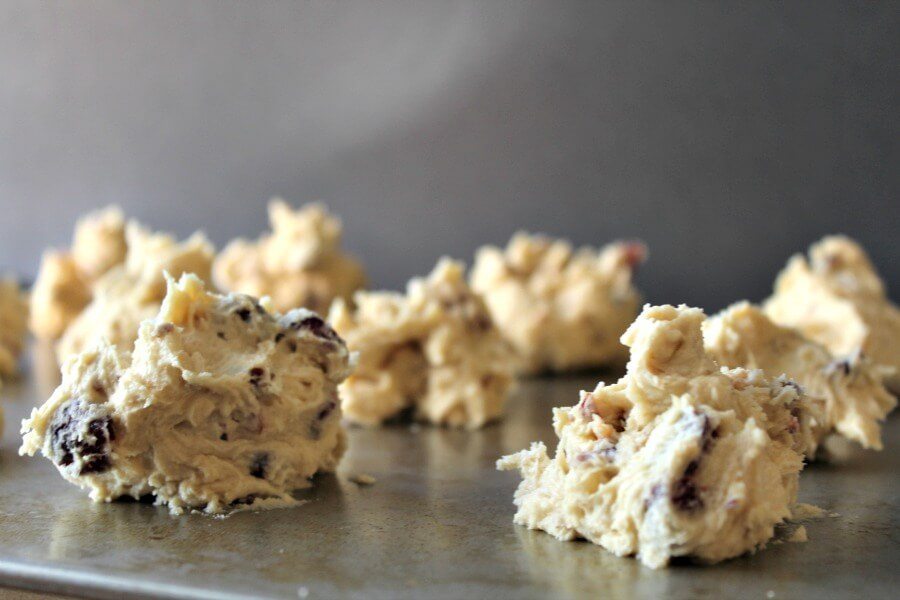 Cranberry Almond Cookies Mounds of cookie dough on a baking sheet