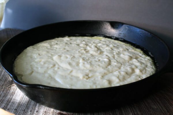 cornbread batter in a skillet
