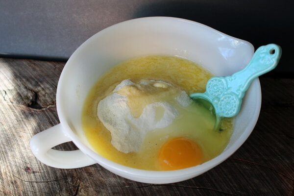 ingredients to make cornbread in a white bowl