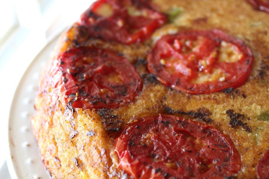 Sweet and savory Cheddar Tomato Cornbread is as delicious as it sounds! Sweet corn, green chiles, cheddar cheese and red ripe tomatoes round out this bread.