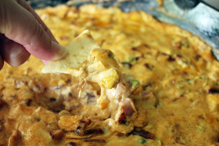 Football time in Arkansas is here, and so is this awesome recipe for Hot Ham Dip. Or as we like to call it "Woo Pig Sooie!" Dip. Perfect for your next Arkansas Tailgate Party. Full of browned ham, caramelized onions, and cheese, this appetizer recipe is like crack in a skillet. Arkansas Tailgate Recipe - Wooo Pig Sooie Hot Ham Dip