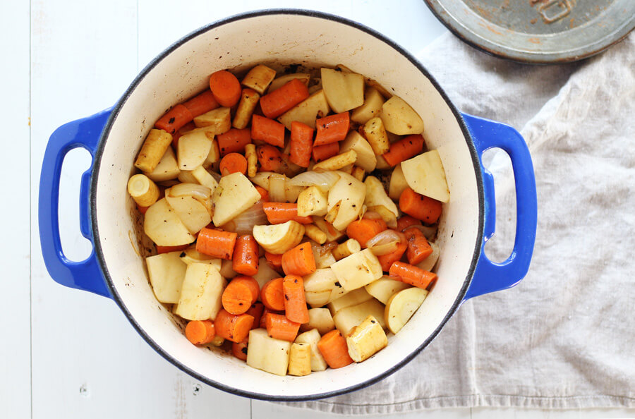Hearty, rustic vegetables like potatoes, carrots, and parsnips are perfect for this Irish Stew. Parsnips, potatoes, carrots and onions simmering in butter.