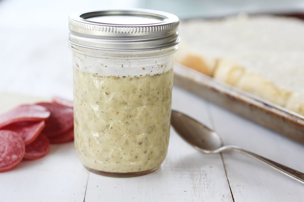 a small jar of homemade vinaigrette dressing