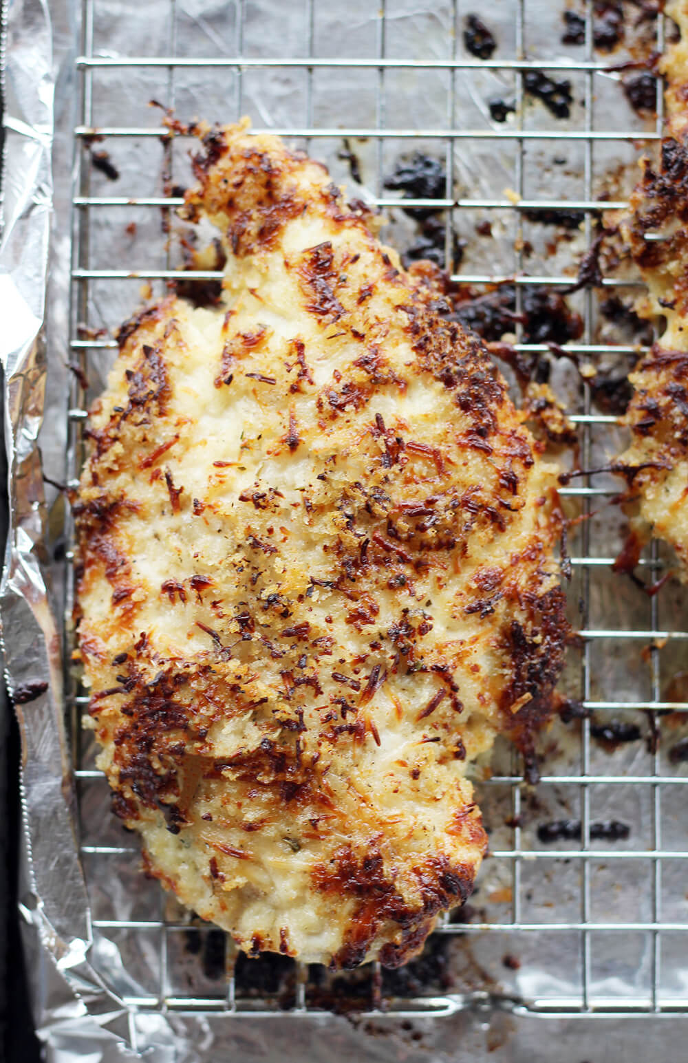 baked parmesan chicken on a baking sheet