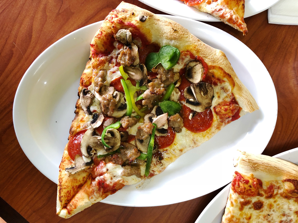 Baked to Order Pizza by the Slice at Déjà Vu in San Francisco