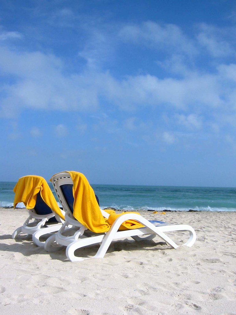 Miami beach chairs Day in the sun on the beach in Miami. juicyverve