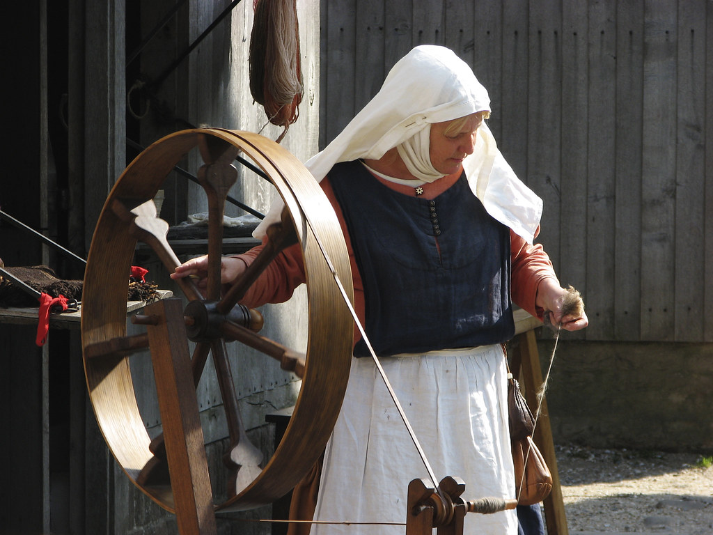 spinning wheel medieval woman spinning Hans Splinter Flickr