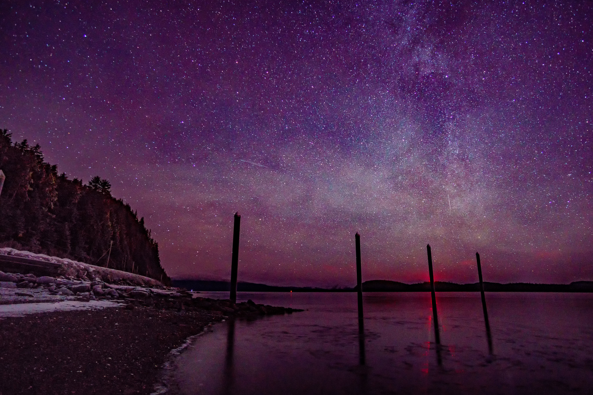 Wooden pillars point to the Milky Way. Juneau, AK [2048 x 1366][OC] r