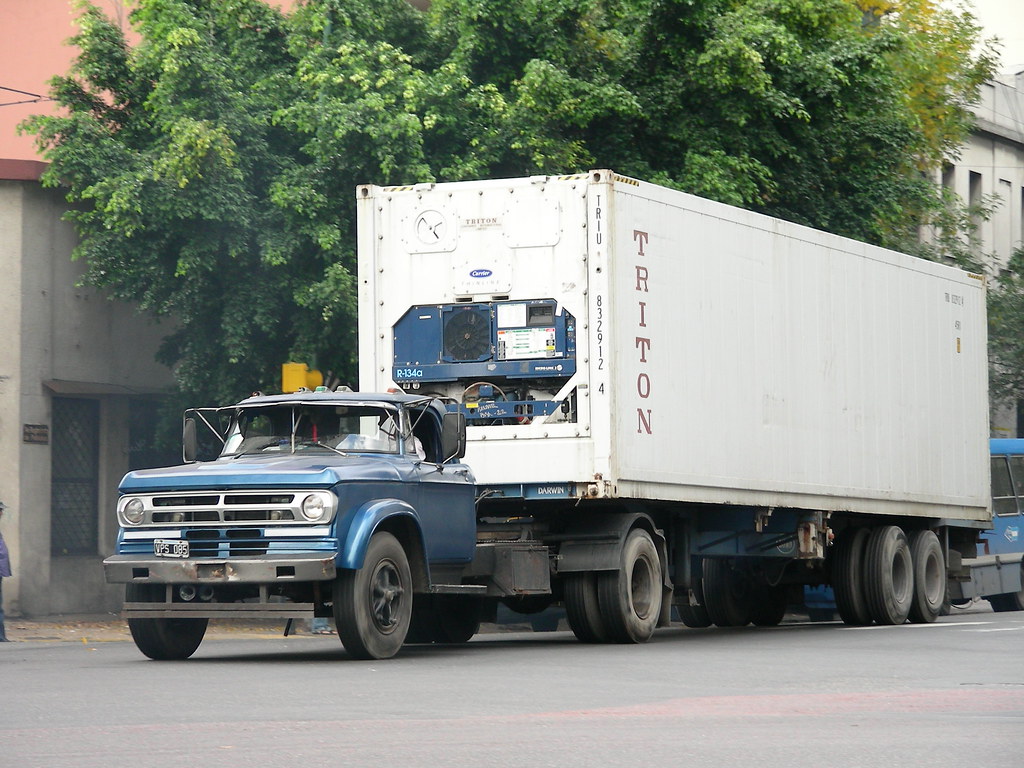 Dodge Tractor An old Dodge tractor pulling a trailer towar… Flickr