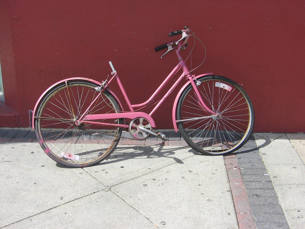 Pink Bicycle Without a Seat and a Flat Front Tire iirraa Flickr