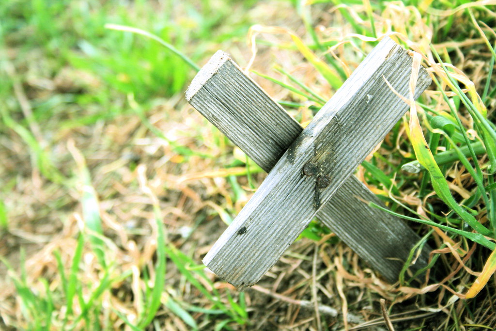 small wooden cross in grass KOREphotos Flickr