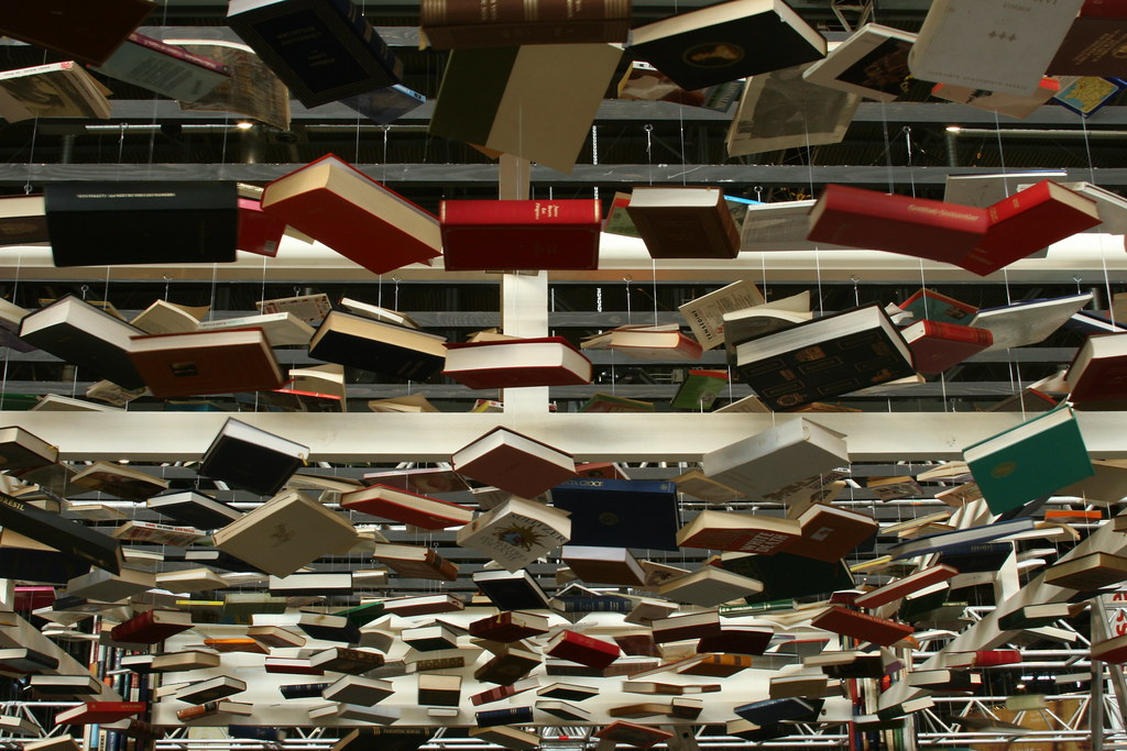 Hanging books The "ceiling" of the booth is made out of su… Flickr