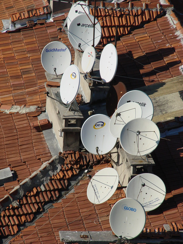 Satellite Dishes A big clump of satellite dishes on a roof… Flickr