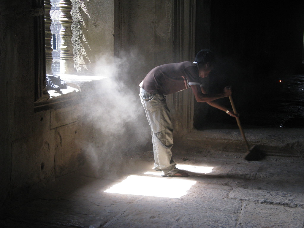 sweeping dust at Angkor Wat Catherine Hine Flickr