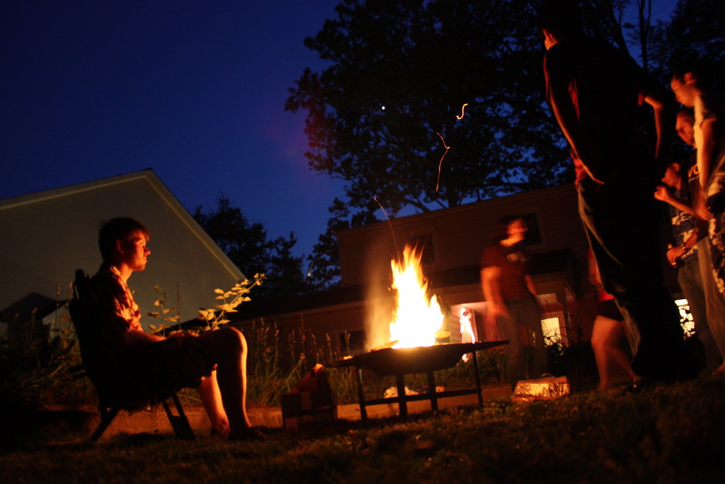 Great American Backyard Campout Gathered around the fire… Flickr