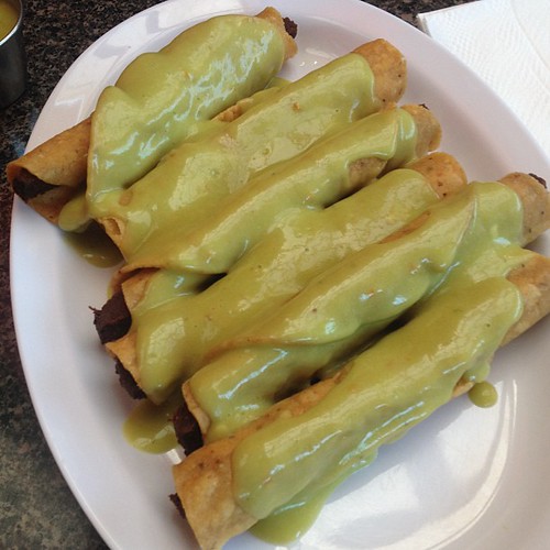 Vegan taquitos topped with avocado sauce flacostacos wha… Flickr