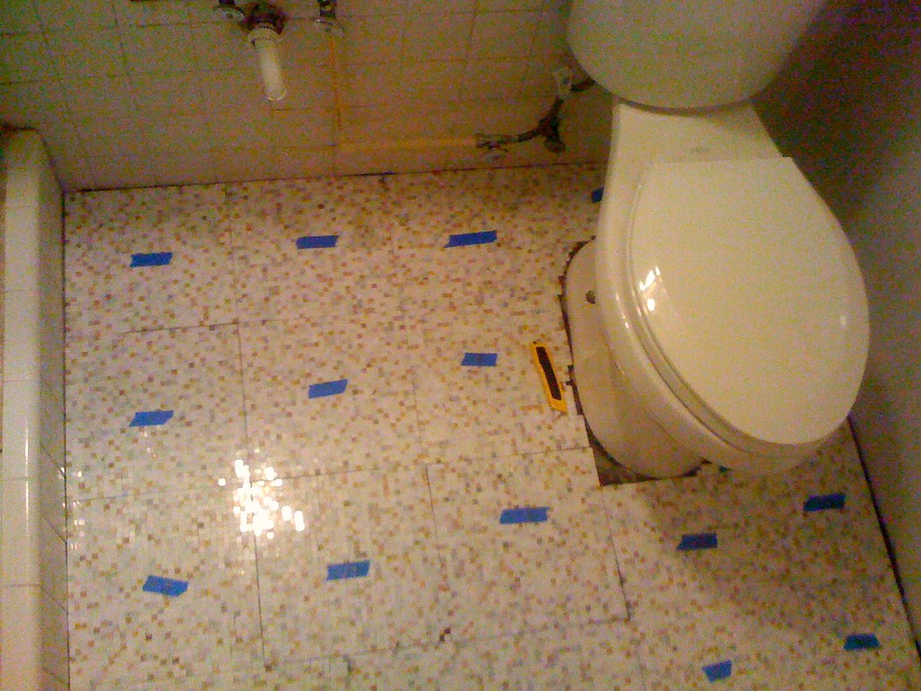 bathroom floor tile set halfway done laying 12" x 12" sh… Flickr