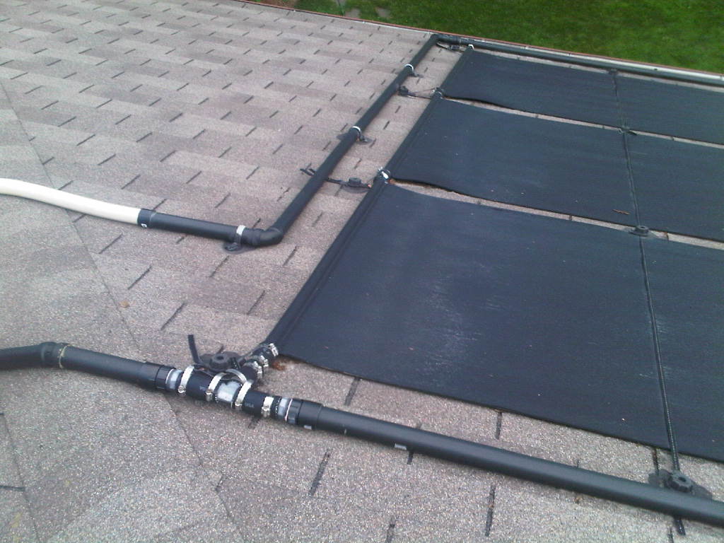 solar water heating mats with multiple roof protrusions Flickr