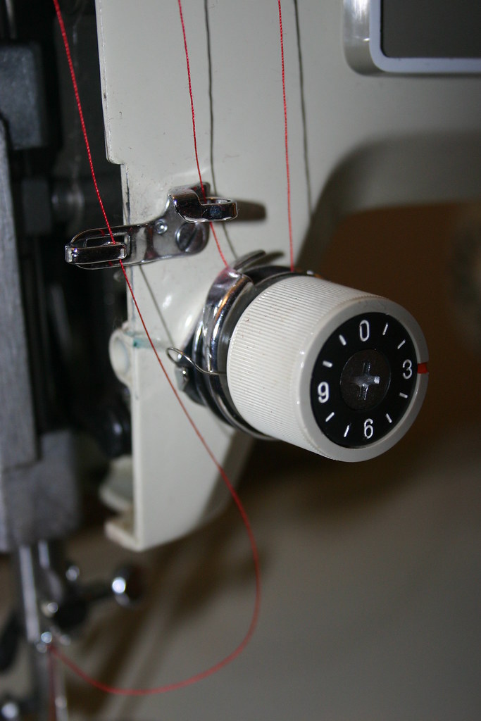 more of the threading guides and the tension adjustment kn… Flickr