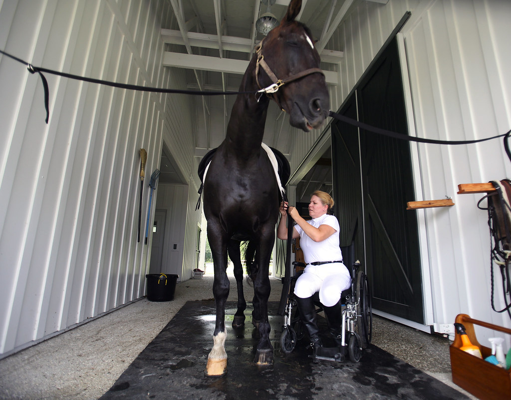 Disabled Horse Rider metro Kim Jones straps a saddle on… Flickr