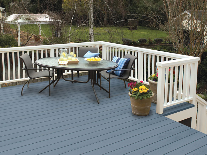 Blue House With Stained Deck Blue/gray classic home with charcoal