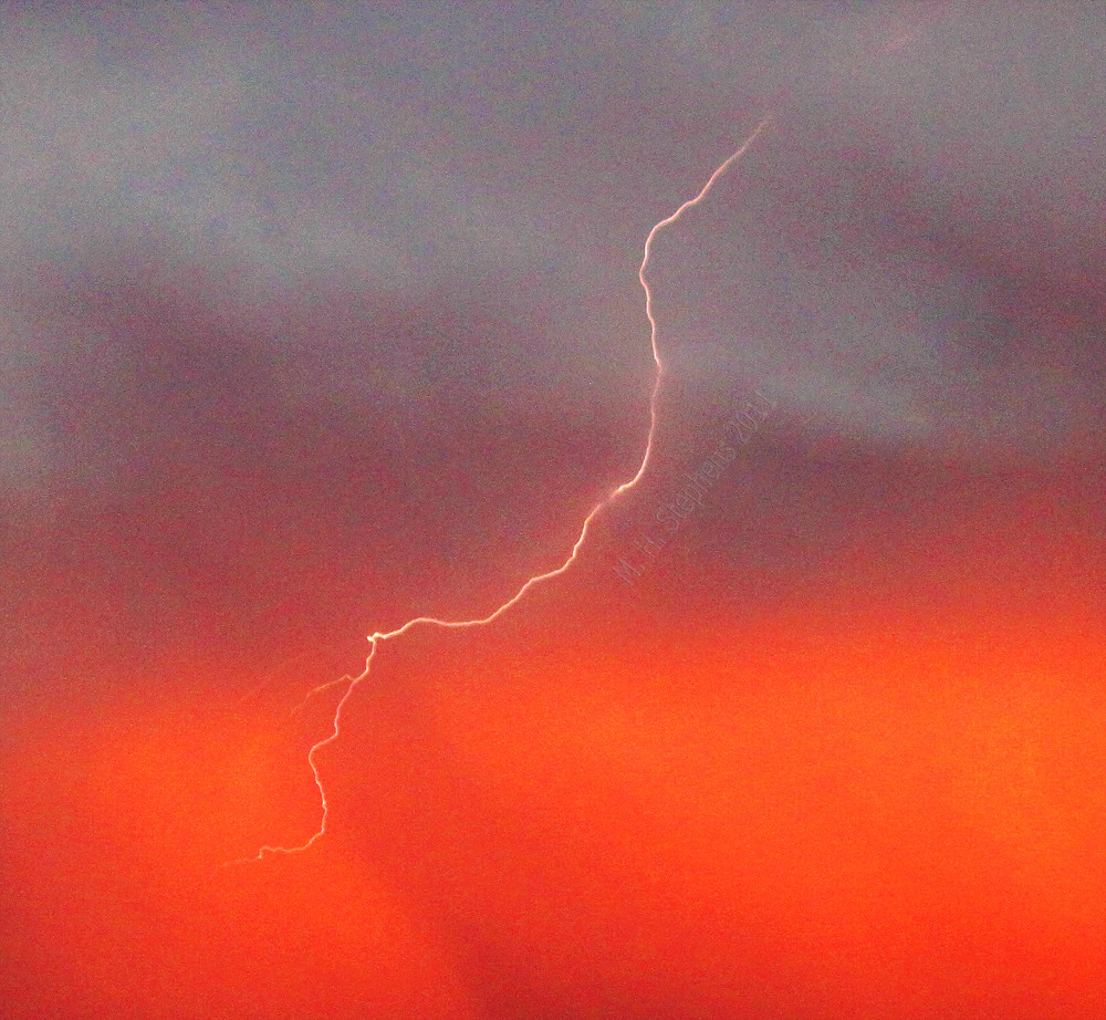 Low Cal Lightning Shot of a small lightning bolt at sunset… ICK9S