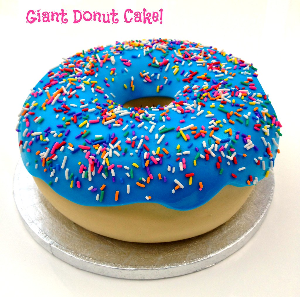 Giant Donut Cake Vanilla cake filled with vanilla bean but… Flickr
