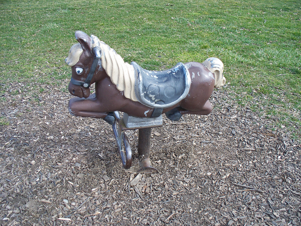 OH Bellevue Playground 3 Horse spring rider at a park in… Flickr