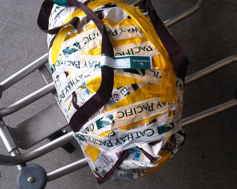 welltaped luggage A burst bag, repaired. 201202141217a waferboard